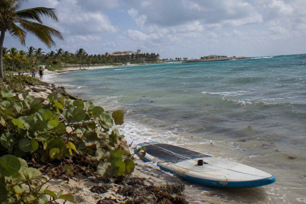Coastline near Punta Cana under a mix of sun and clouds over calm water