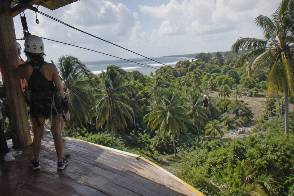 Wooden zipline platform built into a jungle hillside in the Anamuya Mountains